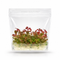 A sterile Vitro Culture tissue culture bag containing healthy young Aciotis Acuminifolia plantlets with distinct green leaves and rosy pink stems.